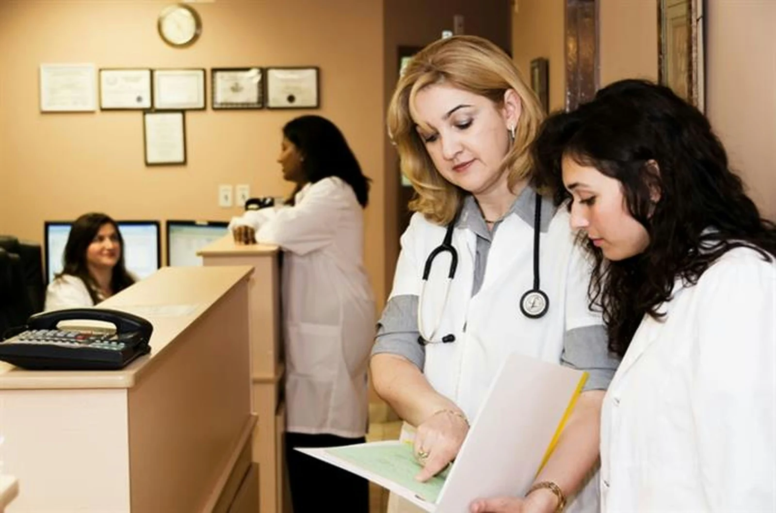 Clinicians reviewing a chart together